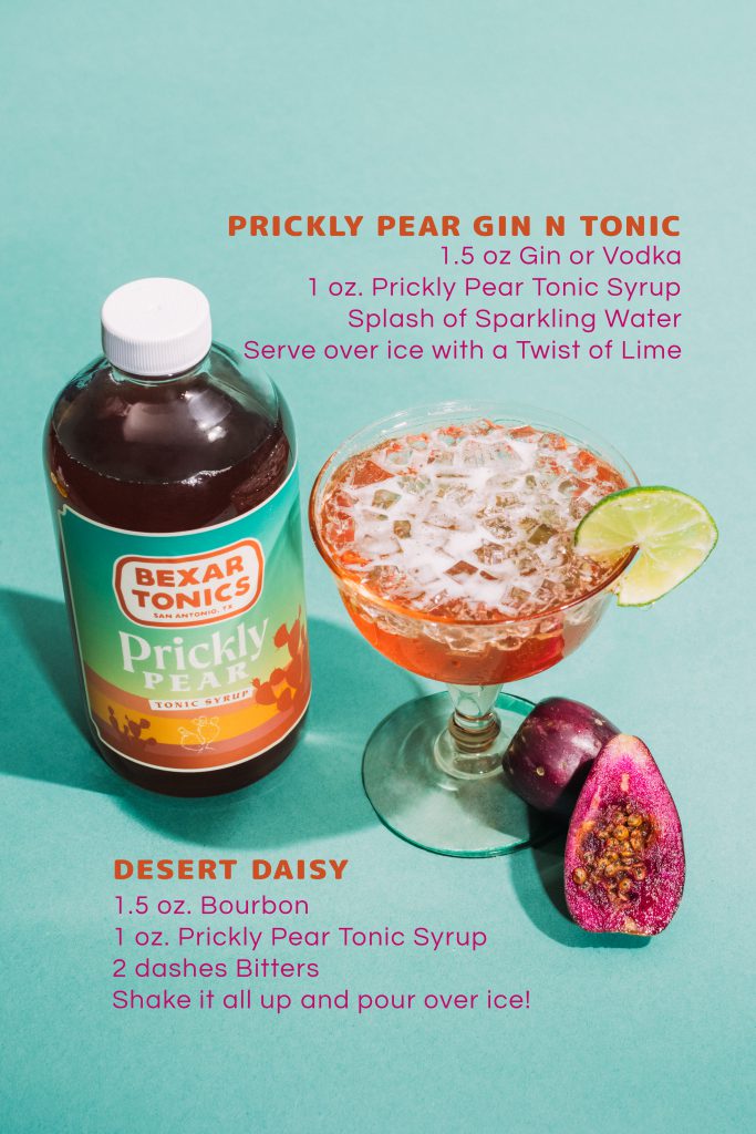 bottle of prickly pear tonic syrup with cocktail and fresh prickly pears